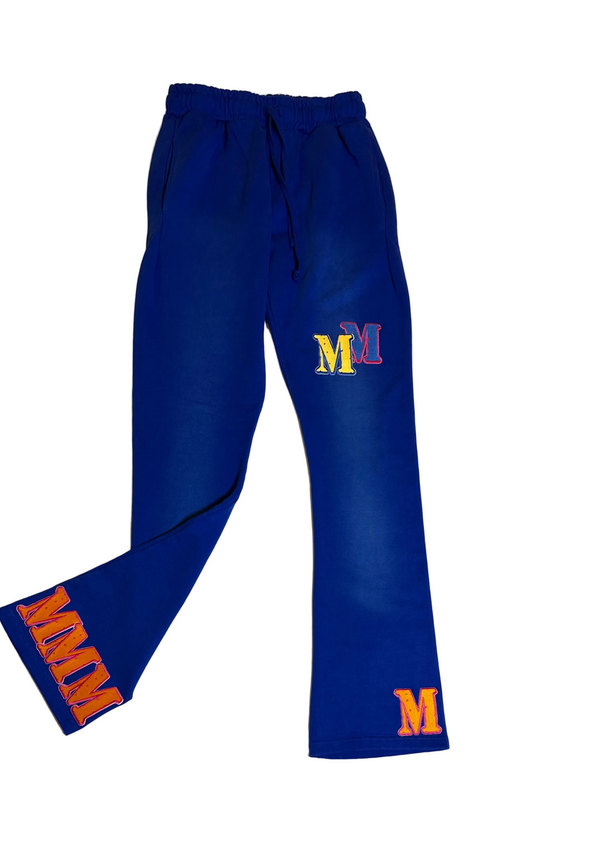 Blue sweatpants with 'M' logos on a light gray background