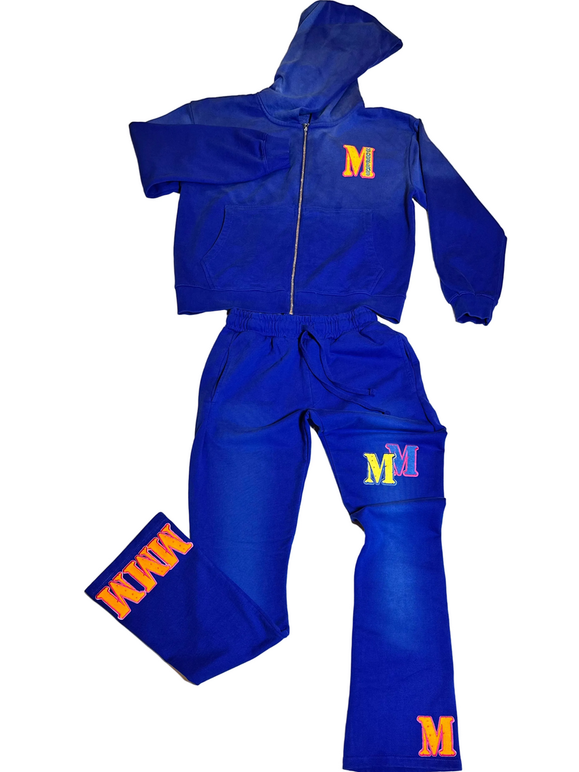 Blue tracksuit with 'M' logo on a white surface