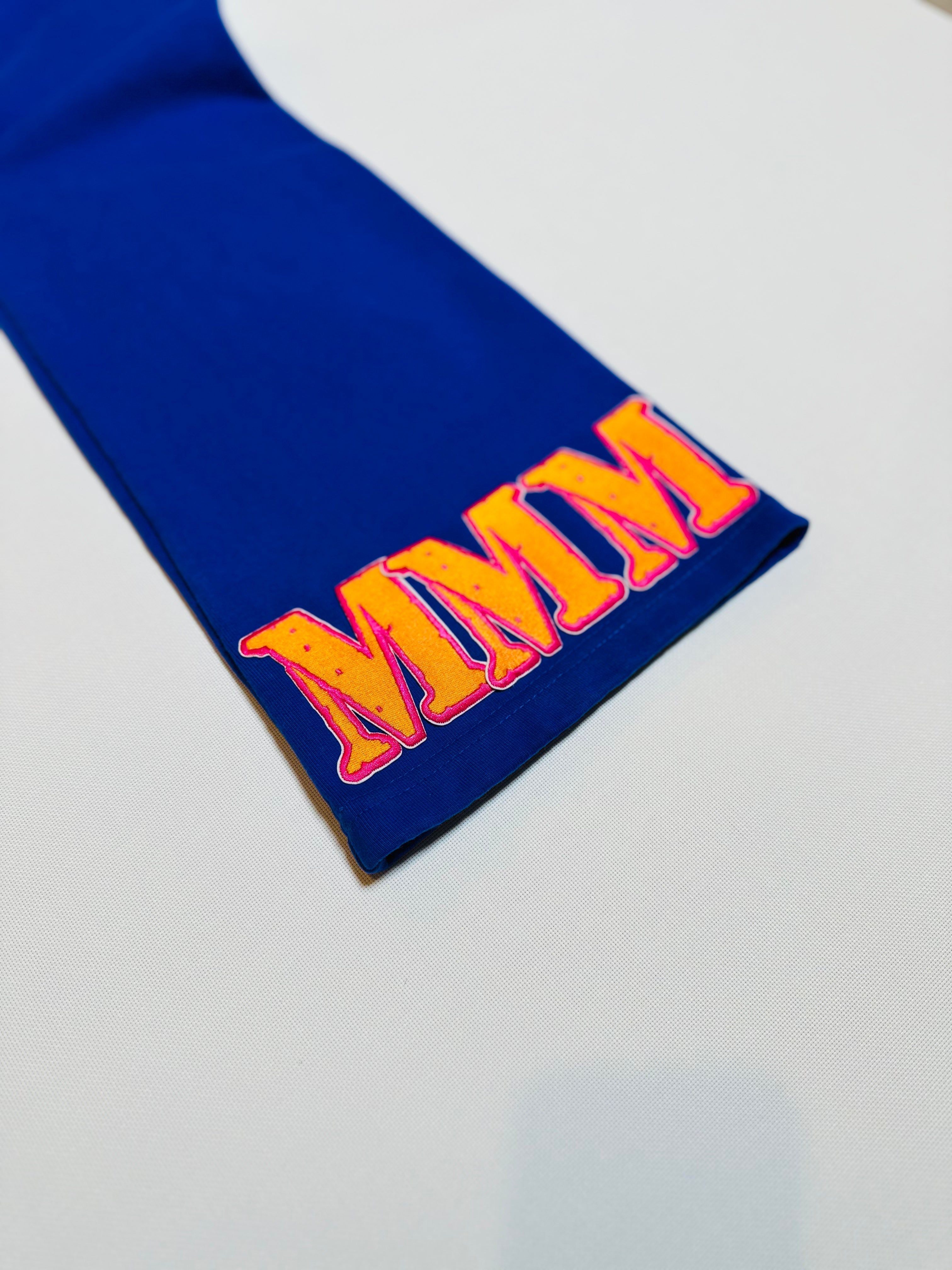 Blue bottom right side pants with 'MMM' text on a white background