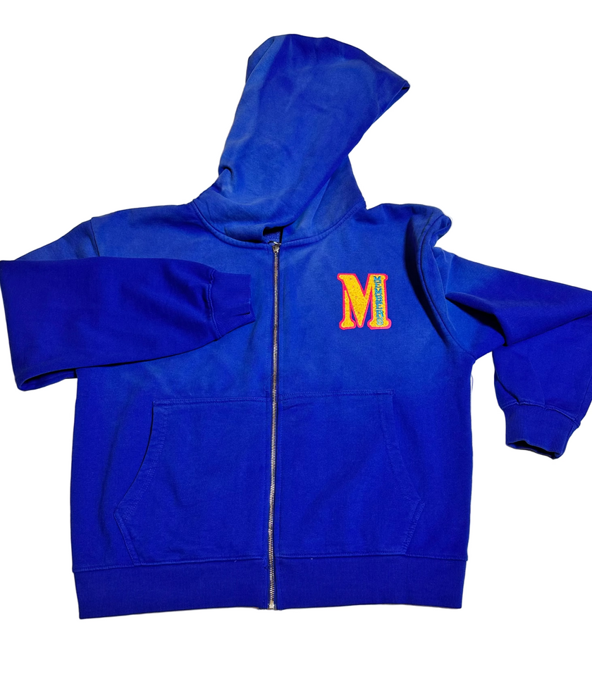 Blue hoodie with a colorful 'M' logo on a light gray background