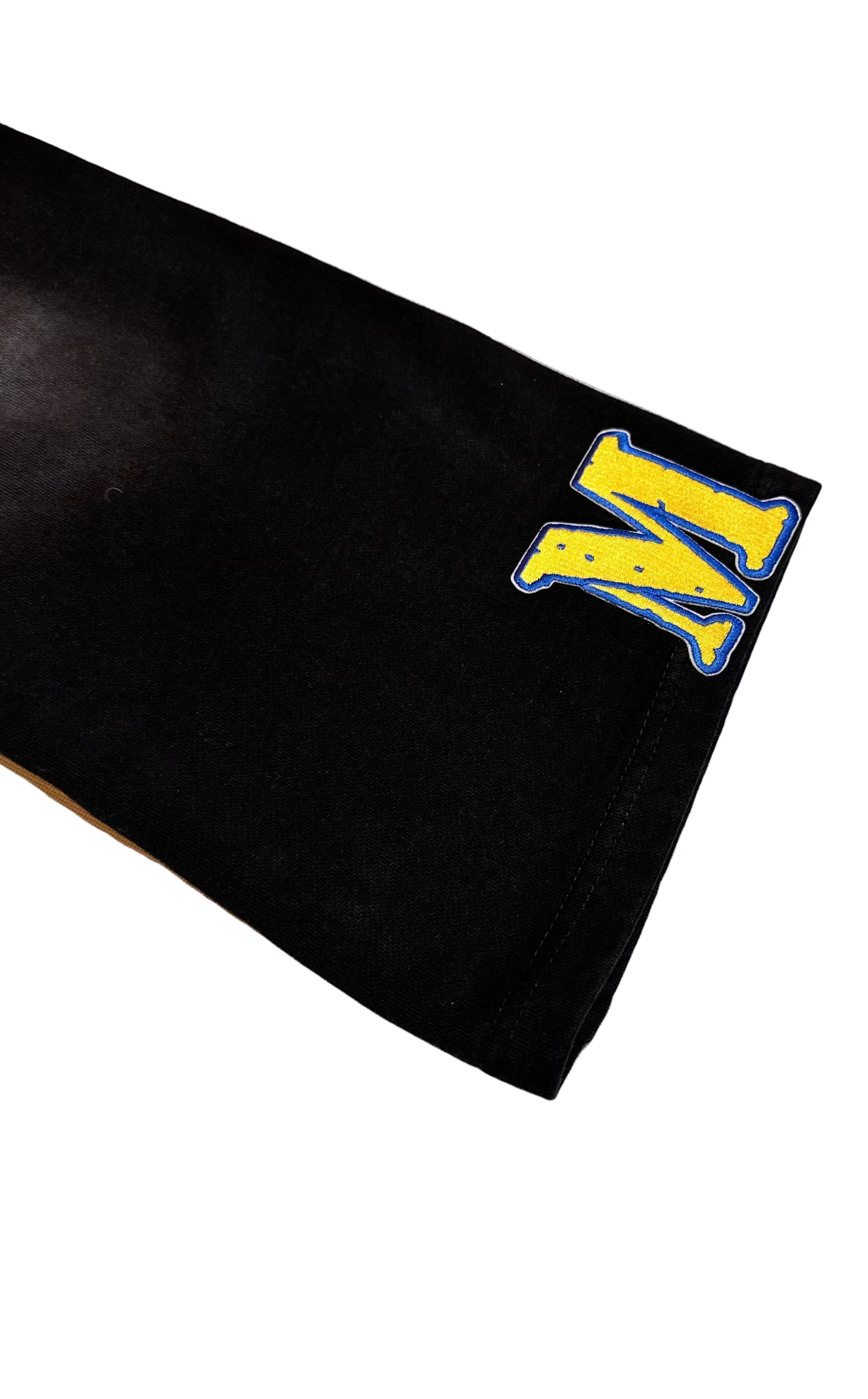 Black mat with yellow and blue logo on a light gray background