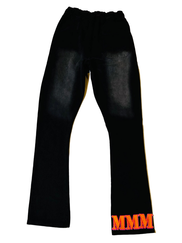Black pants with 3 orange patch on a white background