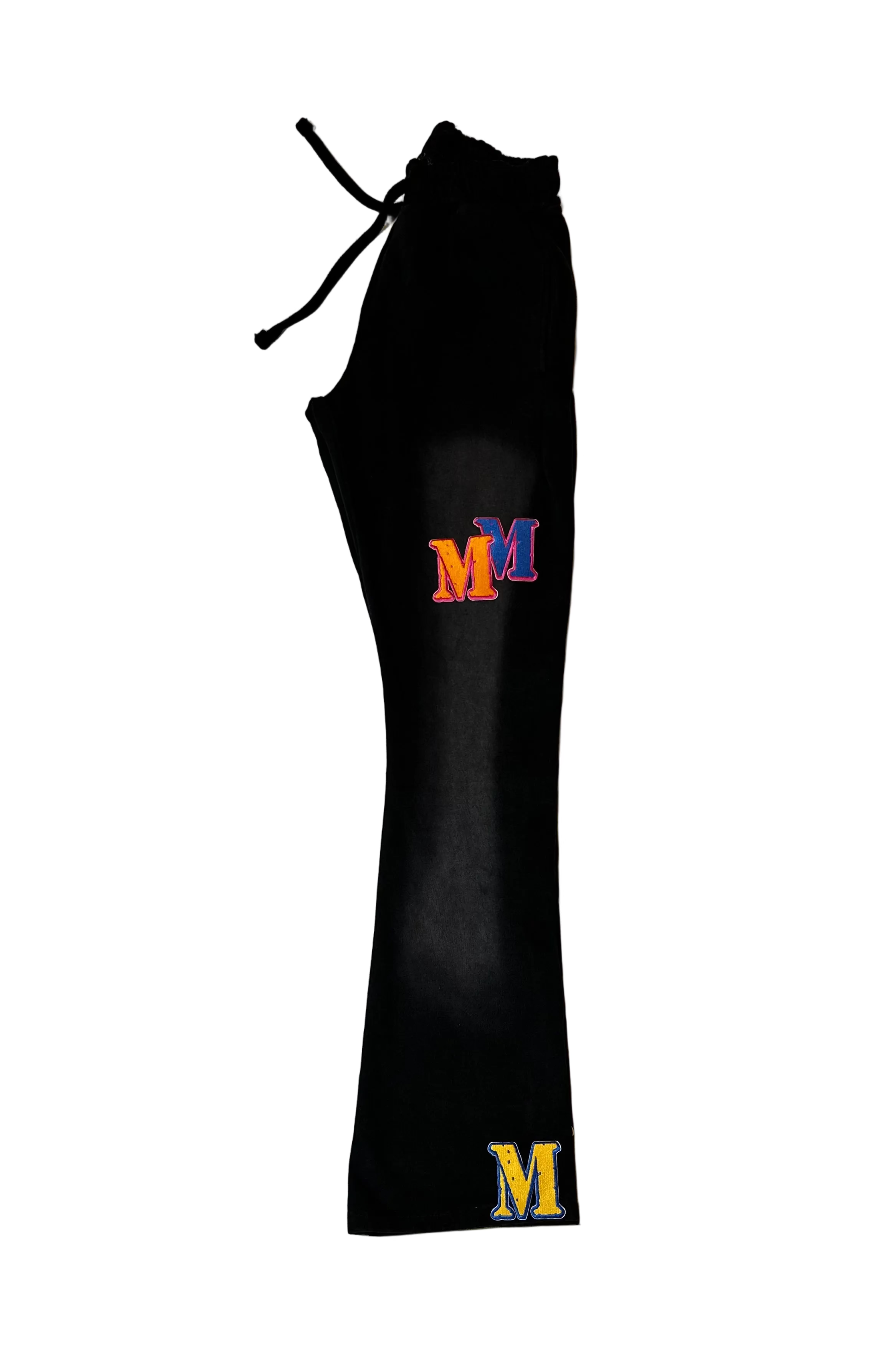 Black drawstring bag with embroidered 'M' logos on a light background