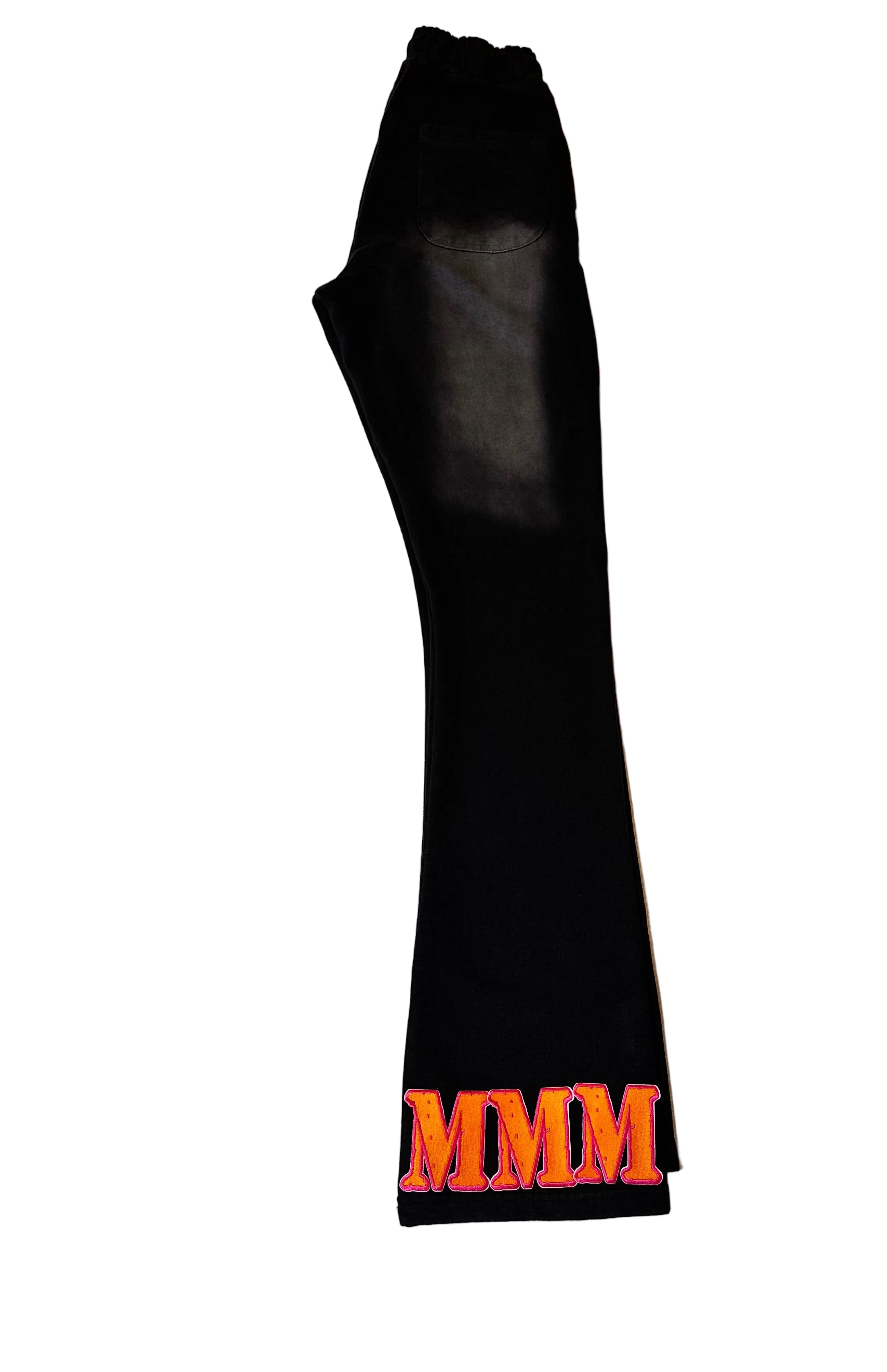 Black pants  with orange 'MMM' letters on a white background